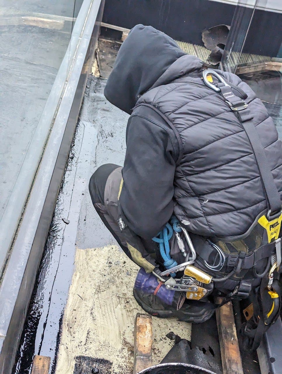 Bituminous waterproofing applied along a rooflight upstand
