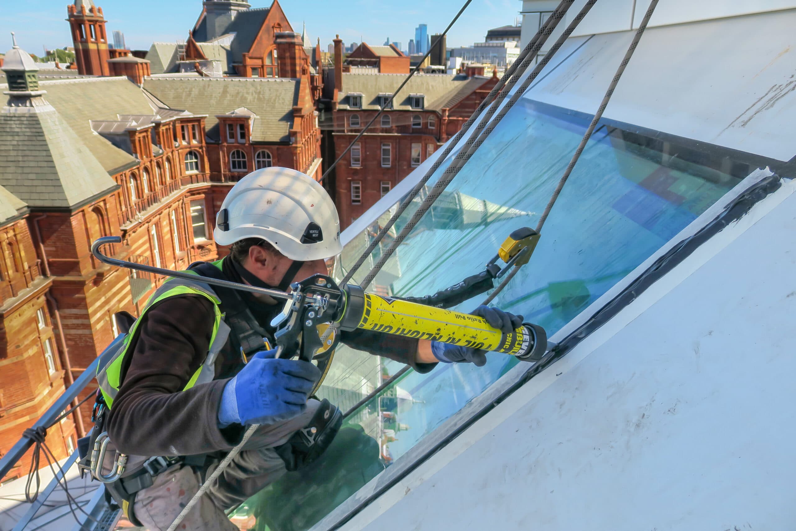 Innova rope access maintenance works on a high-level glazed roof